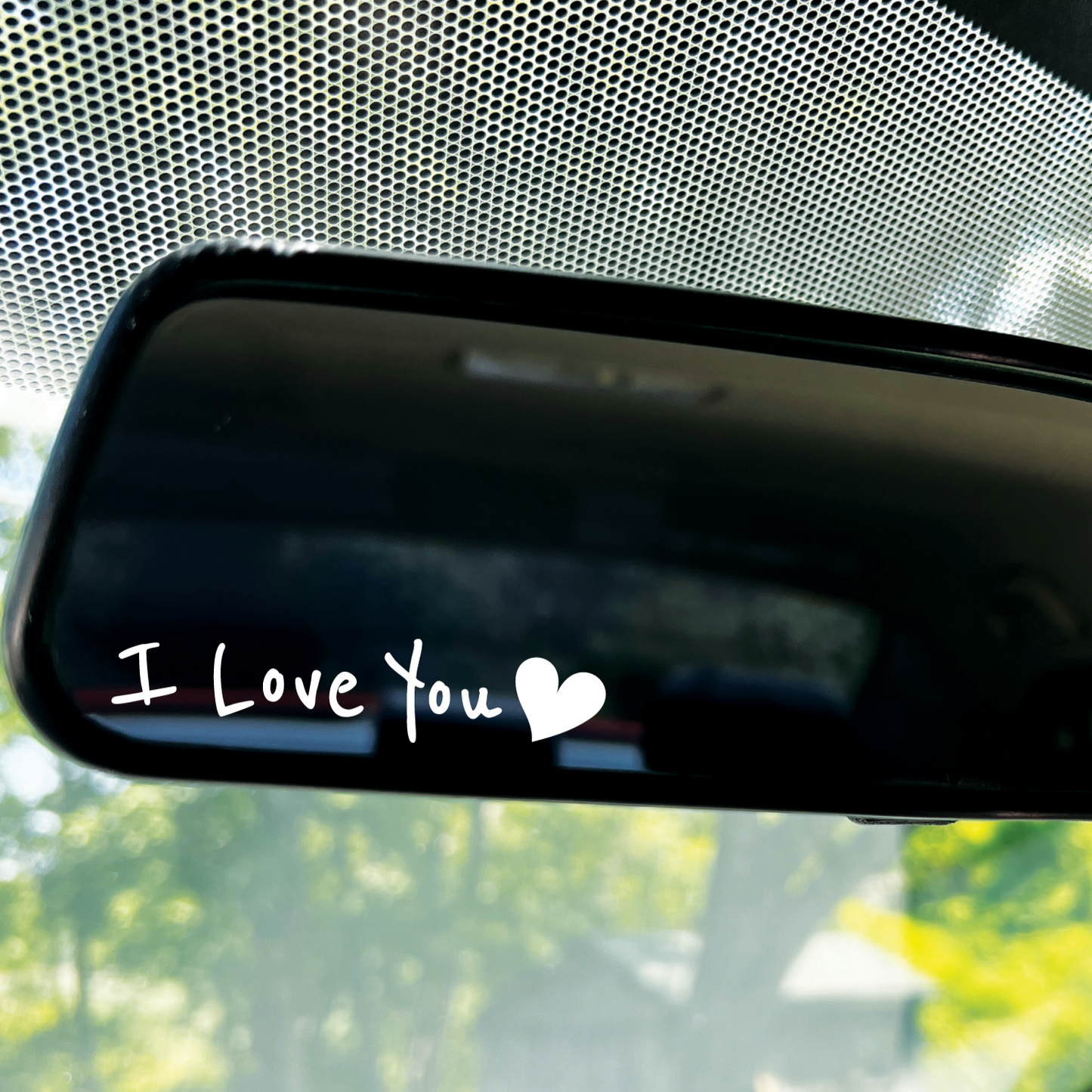 A picture showing a white "I Love You" Decal with a hear at the end of the saying.