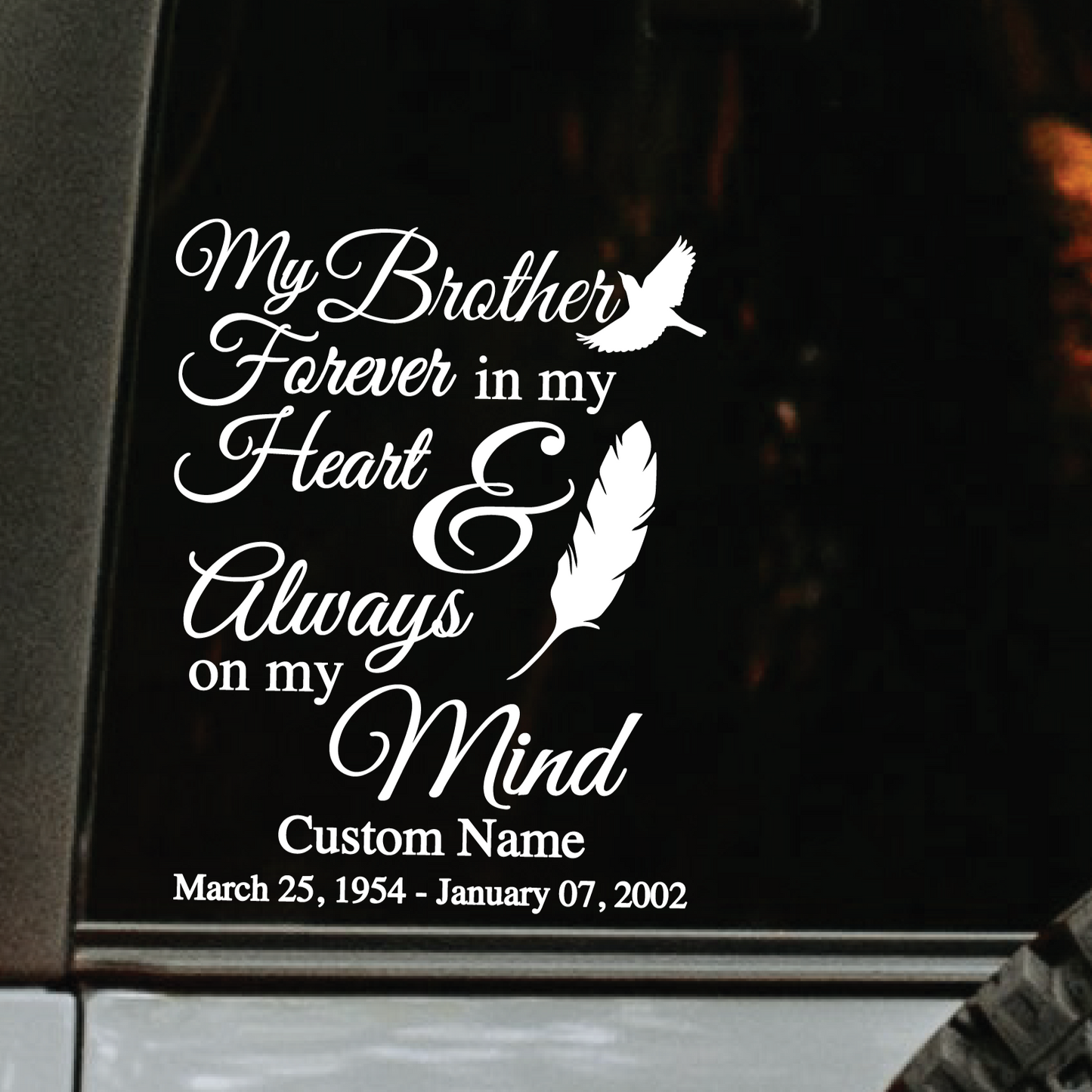 A white decal showcasing a memorial of a brother in the rear window of a vehicle.