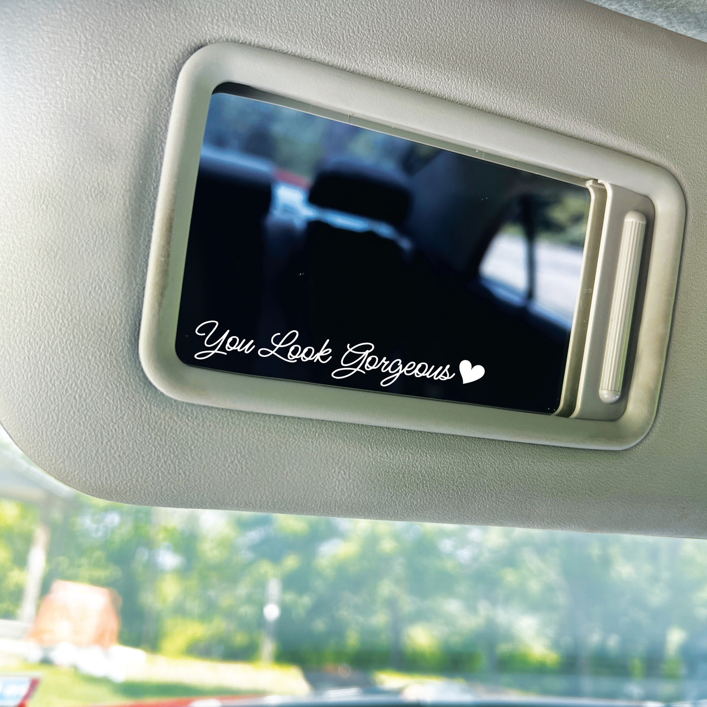 A picture of a white "you look gorgeous" decal. Showcasing the product in perfect view.