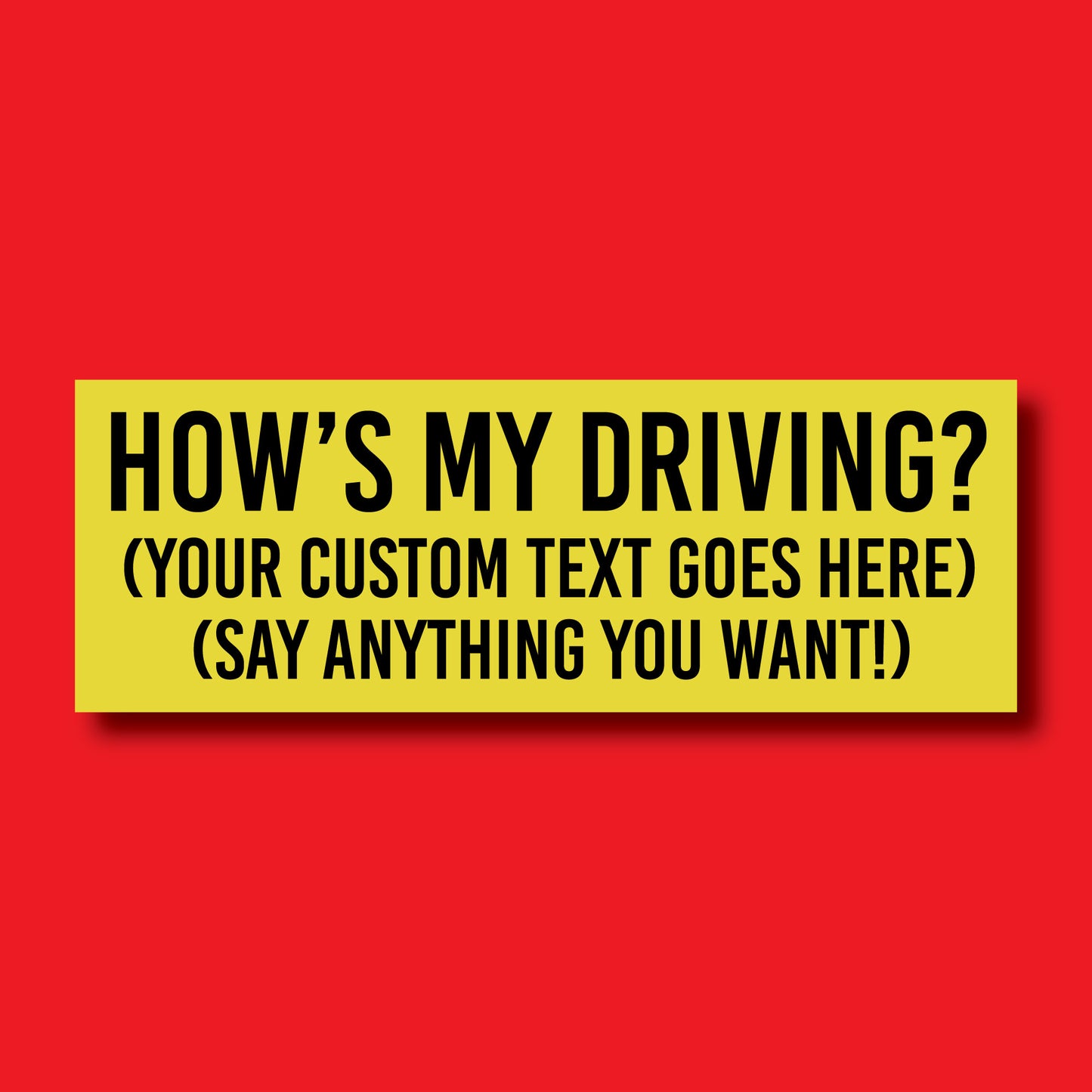 This picture showcases a bumper sticker saying "How's My Driving?" and on a red background.