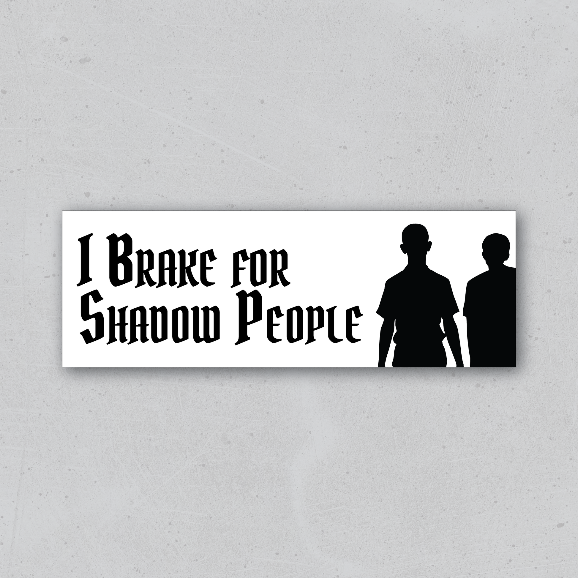 Sticker with 'I Brake for Shadow People' text and silhouettes on a white background