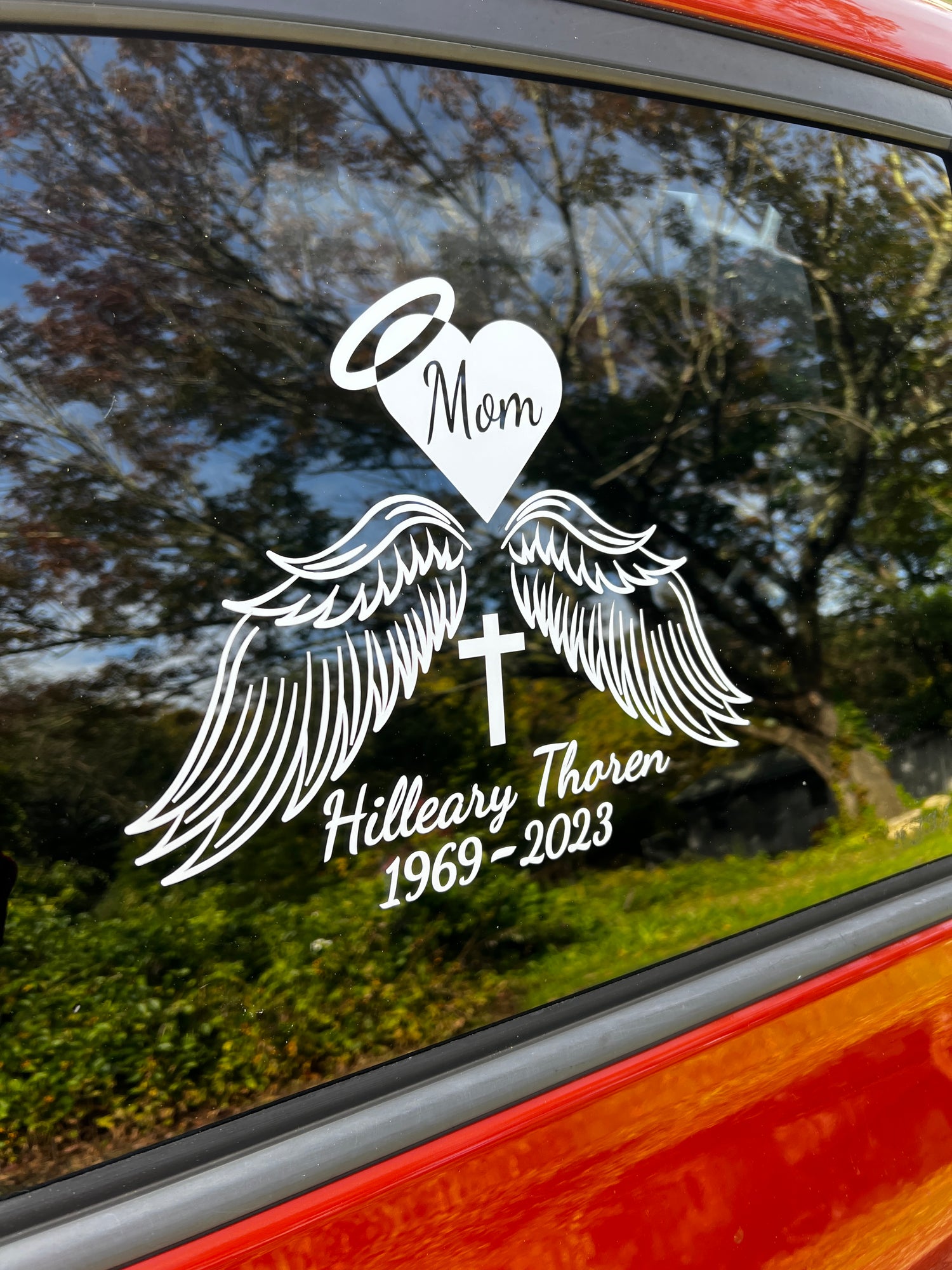 A memorial decal example that was customized and placed on a window for showcasing.