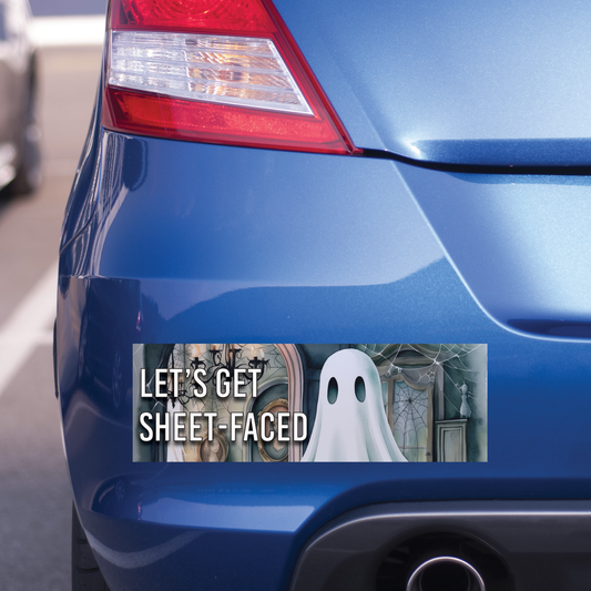 Blue car with a humorous sticker featuring a ghost and text on the back. The bumper sticker says "Let's Get Sheet-Faced".