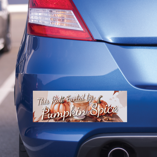 Blue car with a 'Pumpkin Spice' themed bumper sticker on a blurred background